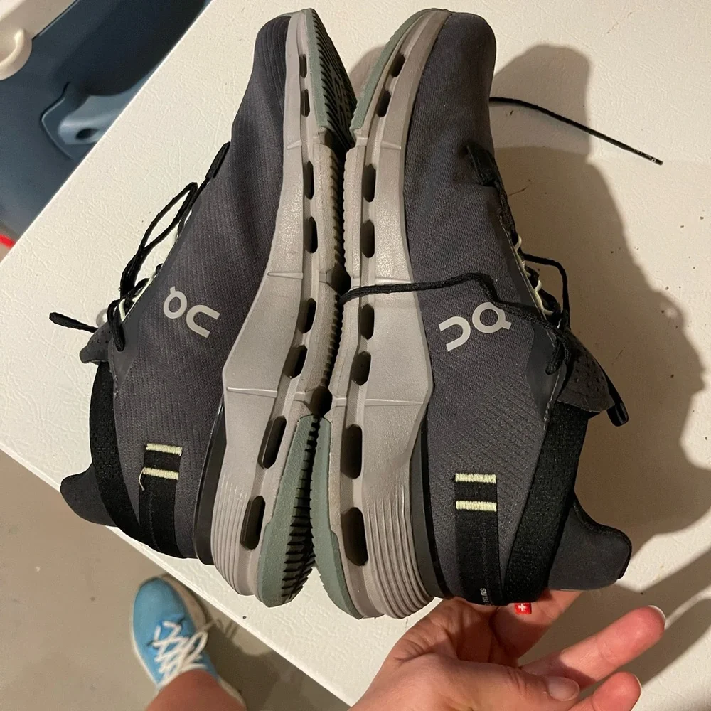 On Running Women’s Athletic Sneakers with Gray Sole and pink and green accents.